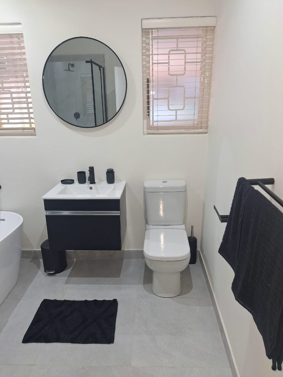 Modern bathroom with vanity and toilet — renovation in Durban