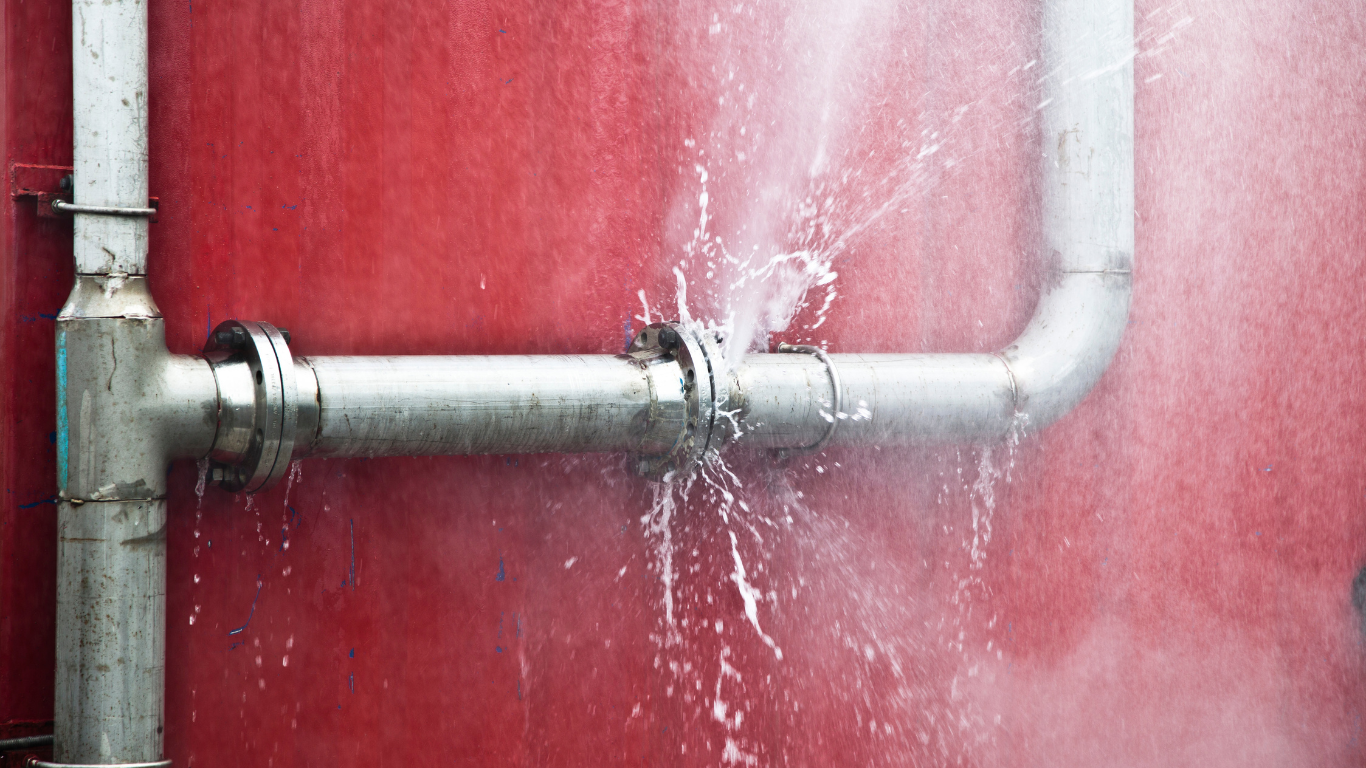 Burst water pipe spraying, the kind of plumbing emergency Oosthuizen's Plumbing Projects fixes in Durban